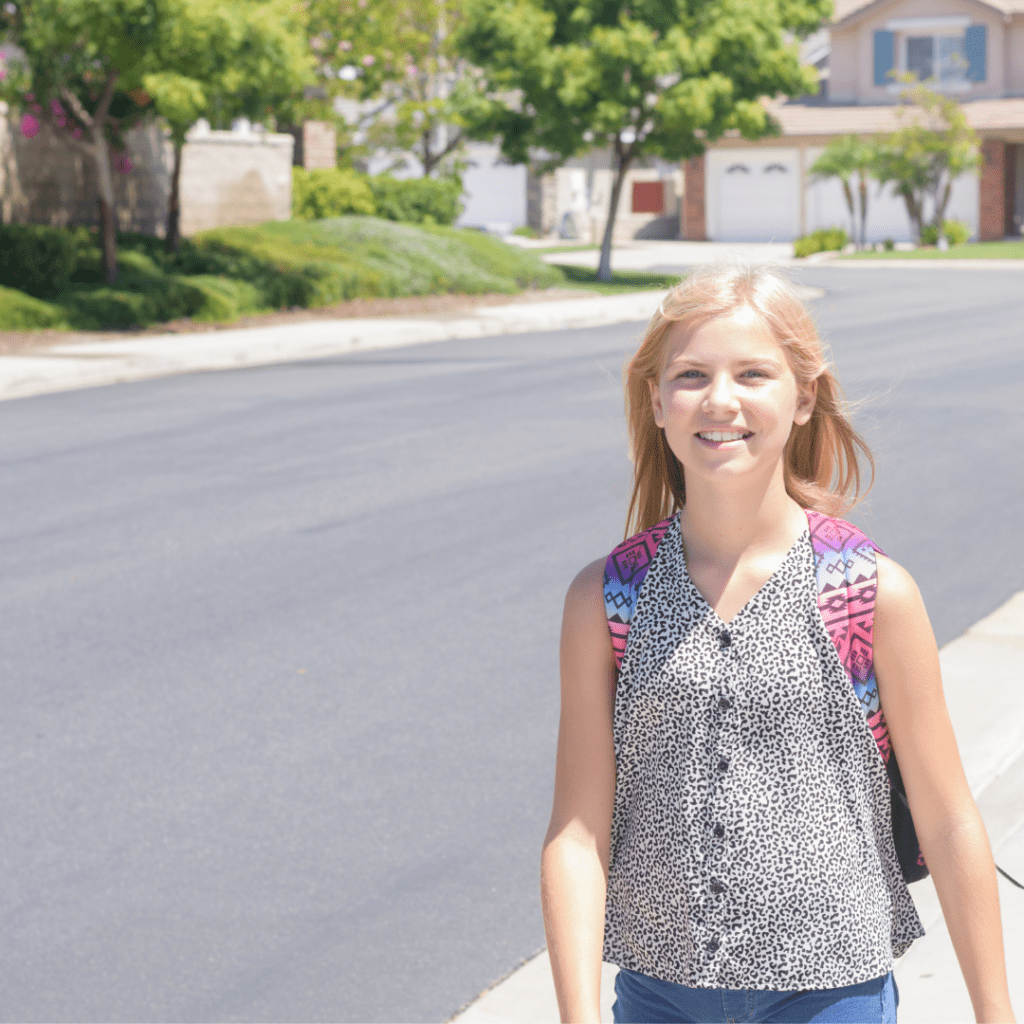 Girl returning home from school.